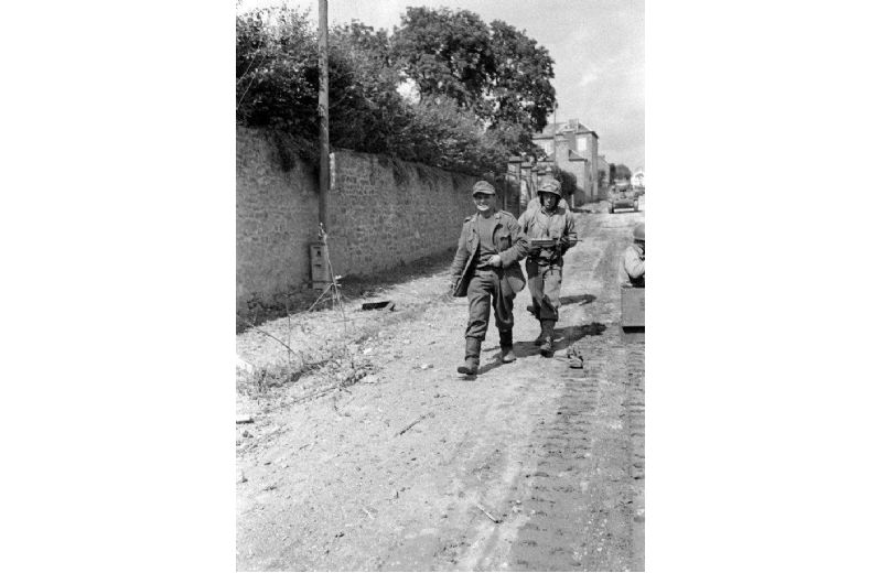 GI escorting German prisoner
